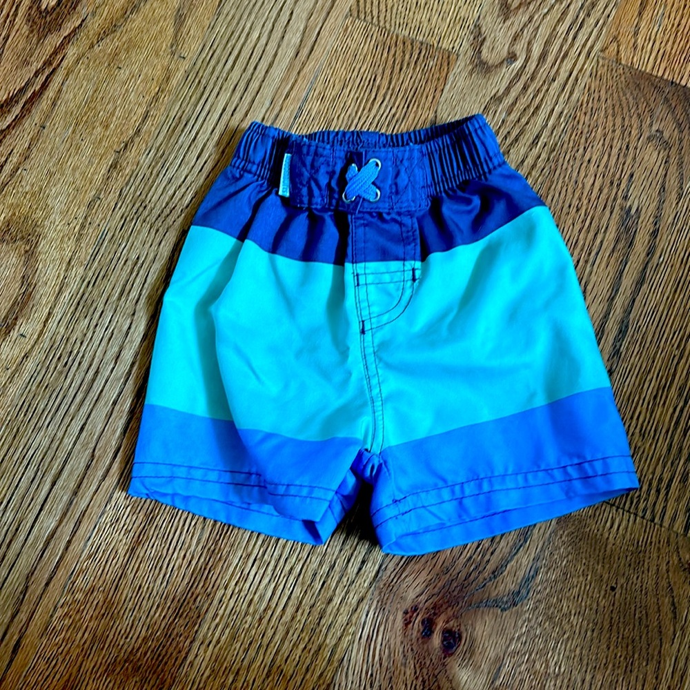Ruggedbutts(by Rufflebutts) swim shorts. 12-18M